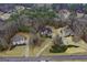 Aerial view of home, showcasing its brick exterior, long driveway, and lush surroundings at 1442 Swiftwater Cir, Mcdonough, GA 30252