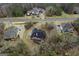 Aerial view of the rear of a home displaying a deck, lush landscape, and surrounding homes at 1442 Swiftwater Cir, Mcdonough, GA 30252