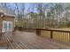 Spacious wooden back deck offering plenty of room for outdoor furniture and entertaining at 1442 Swiftwater Cir, Mcdonough, GA 30252