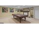 Basement area featuring a pool table and a fireplace for entertainment at 1442 Swiftwater Cir, Mcdonough, GA 30252