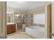 Luxurious bathroom with a soaking tub and glass shower for ultimate comfort and relaxation at 1442 Swiftwater Cir, Mcdonough, GA 30252
