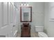 Stylish bathroom with vanity sink, framed mirror, and good lighting, perfect for guests and residents at 1442 Swiftwater Cir, Mcdonough, GA 30252