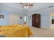 Large main bedroom with blue walls, ceiling fan, and carpet floors at 1442 Swiftwater Cir, Mcdonough, GA 30252