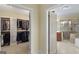 Ensuite view of the walk-in closet and primary bath with seamless, convenient, and luxurious transition at 1442 Swiftwater Cir, Mcdonough, GA 30252
