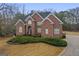 Charming brick two-story home featuring a well-maintained lawn and a spacious driveway at 1442 Swiftwater Cir, Mcdonough, GA 30252
