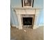 Close up of the beautiful fireplace with elegant white mantel and stone surround at 1442 Swiftwater Cir, Mcdonough, GA 30252