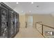 Bright upstairs hallway with decorative built-in cabinets and hardwood railing at 1442 Swiftwater Cir, Mcdonough, GA 30252
