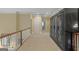 Hallway with custom wardrobes providing ample storage and a convenient layout with natural lighting at 1442 Swiftwater Cir, Mcdonough, GA 30252