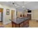 Granite topped kitchen island with gas cooktop and lots of drawer and cabinet storage at 1442 Swiftwater Cir, Mcdonough, GA 30252