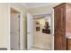 Hall view of the home showcasing a comfortable living room with a fireplace, creating a warm ambiance at 1442 Swiftwater Cir, Mcdonough, GA 30252