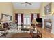 Inviting living room with hardwood floors, a fireplace, high ceilings, and French doors at 1442 Swiftwater Cir, Mcdonough, GA 30252