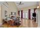 Bright living room with high ceilings, hardwood floors, fireplace, and double doors to the exterior at 1442 Swiftwater Cir, Mcdonough, GA 30252