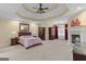 Expansive main bedroom suite with a fireplace, sitting area, and a large custom trey ceiling at 1442 Swiftwater Cir, Mcdonough, GA 30252