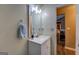 Bathroom featuring a small white vanity and a door to the rest of the house at 1484 Stephens Pond Vw, Loganville, GA 30052