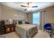Bedroom featuring a bed, ceiling fan, two dressers, neutral walls, and light-colored carpet at 1484 Stephens Pond Vw, Loganville, GA 30052