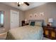 Bedroom featuring a bed, ceiling fan, two dressers, neutral walls, and light-colored carpet at 1484 Stephens Pond Vw, Loganville, GA 30052