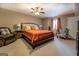 Bedroom with a large bed, arm chair, side tables, curtains, and neutral walls at 1484 Stephens Pond Vw, Loganville, GA 30052