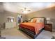 Bedroom with a large bed, dresser, side tables, mirror, and walk-in closet at 1484 Stephens Pond Vw, Loganville, GA 30052
