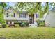 Charming two-story home with a brick front porch and lush landscaping at 1484 Stephens Pond Vw, Loganville, GA 30052