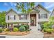 Inviting two-story home with manicured landscaping, brick accents, and a charming front entrance at 1484 Stephens Pond Vw, Loganville, GA 30052