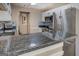Close-up of kitchen showcasing granite countertops, stainless steel appliances, and stylish backsplash at 1484 Stephens Pond Vw, Loganville, GA 30052