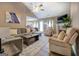 Bright living room features vaulted ceilings, fireplace, plush seating, and an open-concept design at 1484 Stephens Pond Vw, Loganville, GA 30052