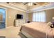Main bedroom featuring carpet, modern ceiling fan, and large windows at 1484 Stephens Pond Vw, Loganville, GA 30052