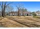 Expansive backyard showcases a well-maintained lawn and landscaping for relaxing outdoor enjoyment at 55 Helen Ln, Stockbridge, GA 30281