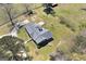 An aerial view of a sprawling estate, highlighting the property's generous acreage and well-maintained grounds at 1092 E Lake Rd, Mcdonough, GA 30252