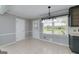Sunny breakfast nook area with tiled floor and a window view for pleasant dining at 1092 E Lake Rd, Mcdonough, GA 30252