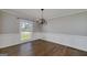 Dining room featuring hardwood floors, chandelier, wainscotting, and window views at 1092 E Lake Rd, Mcdonough, GA 30252