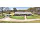 Attractive brick ranch home with a long driveway, scenic landscaping, and ample parking space at 1092 E Lake Rd, Mcdonough, GA 30252