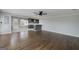 Spacious living room with hardwood floors and an open layout to the kitchen area, great for gathering at 1092 E Lake Rd, Mcdonough, GA 30252