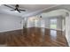 Bright living room boasts hardwood floors, modern fan, and abundant natural light at 1092 E Lake Rd, Mcdonough, GA 30252