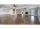 Expansive living room features hardwood floors, fireplace, and open floor plan at 1092 E Lake Rd, Mcdonough, GA 30252