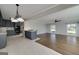 Spacious living area connecting to an adjacent kitchen, ideal for entertaining, and features abundant natural light at 1092 E Lake Rd, Mcdonough, GA 30252