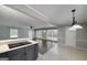 Open-concept living room featuring hardwood floors, neutral paint, and abundant natural light from large windows at 1092 E Lake Rd, Mcdonough, GA 30252