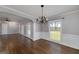 Open layout showcases seamless flow between dining and living spaces, with hardwood floors at 1092 E Lake Rd, Mcdonough, GA 30252