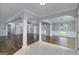 Open floor plan with pillars showcases the seamless transition from dining to living space at 1092 E Lake Rd, Mcdonough, GA 30252