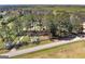 This street view shot showcases the home's long, tree-lined driveway at 1092 E Lake Rd, Mcdonough, GA 30252
