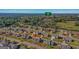 The aerial shot reveals a quiet neighborhood, mature landscaping, sidewalks, and houses with classic suburban appeal at 1141 Abundance Dr, Locust Grove, GA 30248