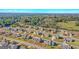 An aerial view highlights homes in a neatly planned community, complete with streets, sidewalks, and mature trees at 1141 Abundance Dr, Locust Grove, GA 30248