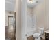 Bright bathroom features a shower over tub, toilet, and neutral wall color at 1141 Abundance Dr, Locust Grove, GA 30248