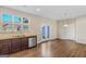 Cozy dining area with hardwood floors, stainless steel appliances, granite countertops, and natural light at 1141 Abundance Dr, Locust Grove, GA 30248