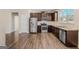 Modern kitchen with stainless steel appliances, granite countertops, and ample cabinet space at 1141 Abundance Dr, Locust Grove, GA 30248