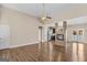 Bright open-concept living area with hardwood floors, fireplace, and natural light at 1141 Abundance Dr, Locust Grove, GA 30248