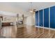 Spacious open-concept living room with hardwood floors, a modern fireplace, and recessed lighting at 1141 Abundance Dr, Locust Grove, GA 30248