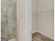 Elegant shower and walk-in closet in bathroom with a light neutral color scheme at 1141 Abundance Dr, Locust Grove, GA 30248