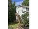 View of back exterior with a set of wooden stairs at 1917 Lake Ridge Ct, Jonesboro, GA 30236