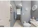 Bathroom features a toilet, sink, mirror and towels at 1917 Lake Ridge Ct, Jonesboro, GA 30236